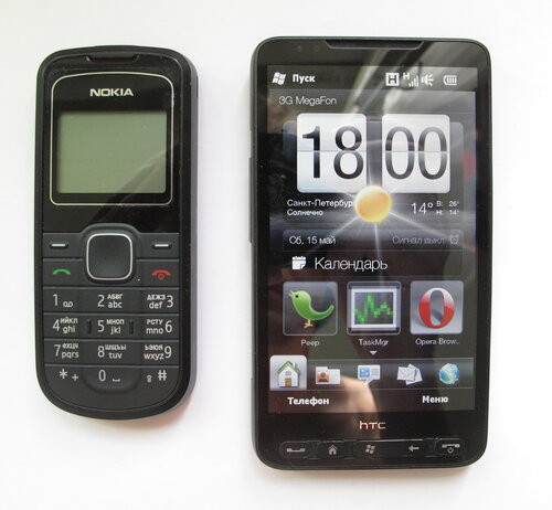 HTC HD2   і поряд для порівняння   Nokia 1202